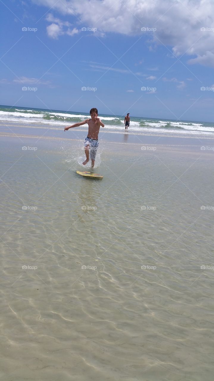 Action Surf. trying out the skim board