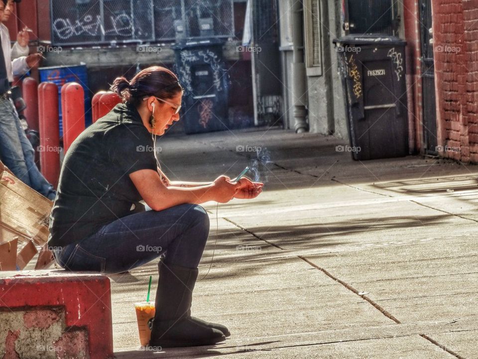 Woman Checking Smartphone On Her Cigarette Break. Cigarette Break