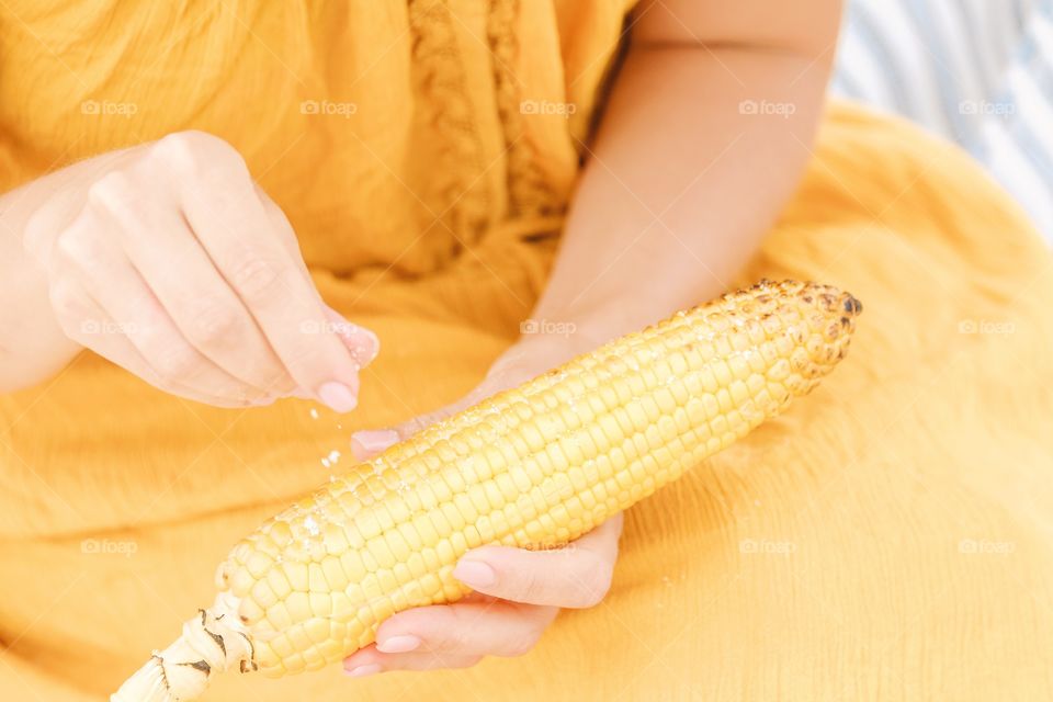 Eating barbecue corn 