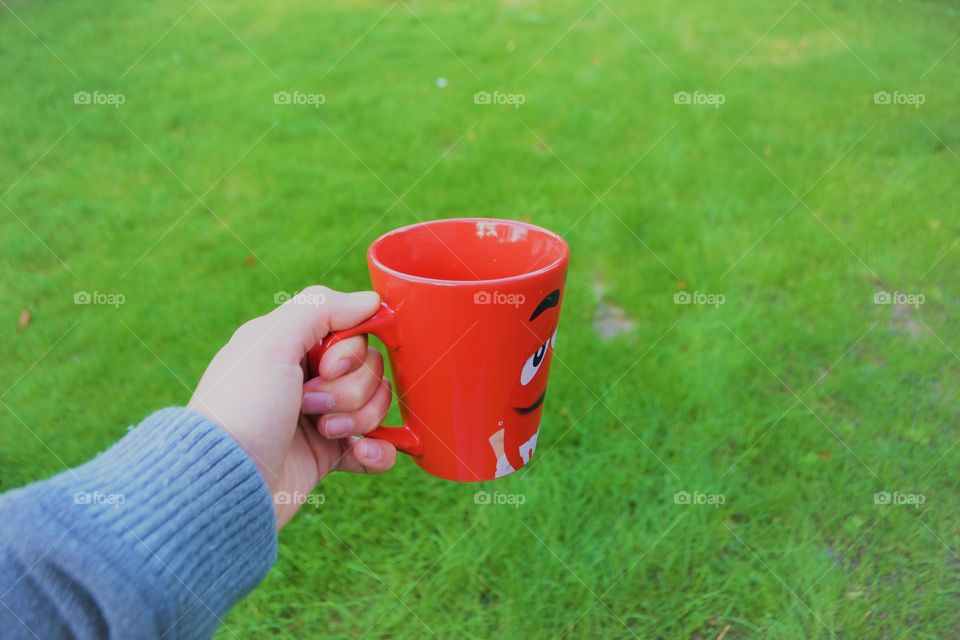 holding a mug