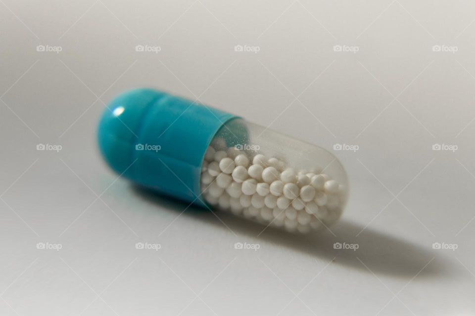 Macro of medicine capsule on a white background