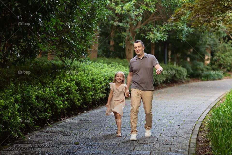 Happy father spending time together with daughter 