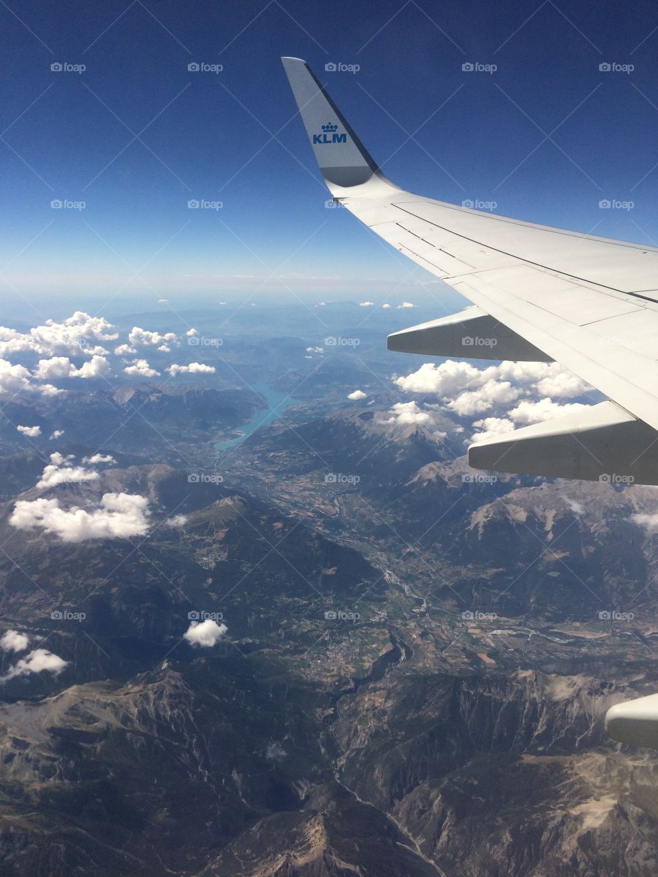 Klm plane in the sky with mountain, sea and cloud