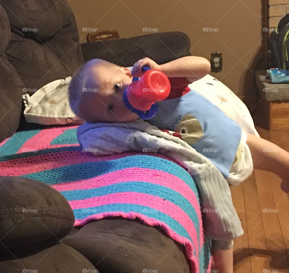 Ready for bed with his blanket and cup