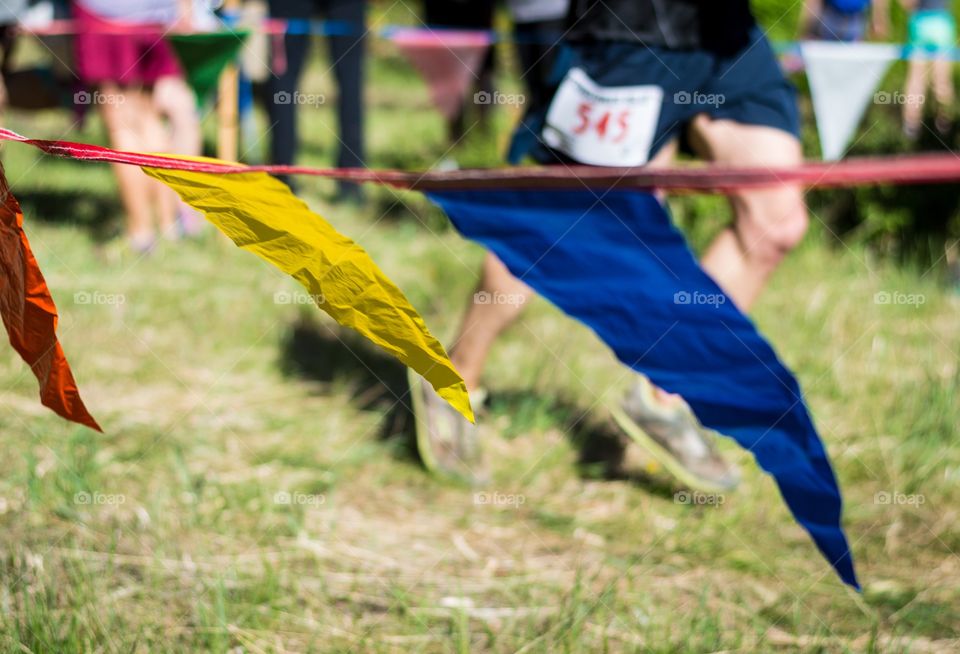 Race day. Runner coming in to the finish if a race.
