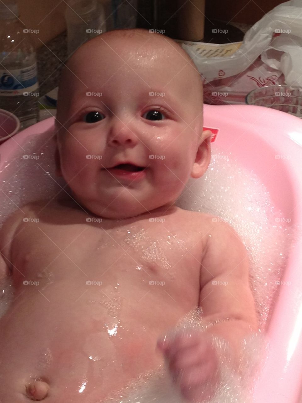 Bath Time. Baby girl getting her bath
