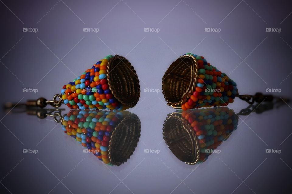 Mirror reflection of colored earrings