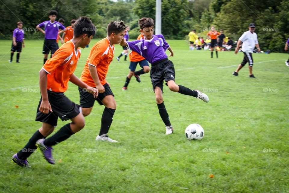 Kids are playing soccer