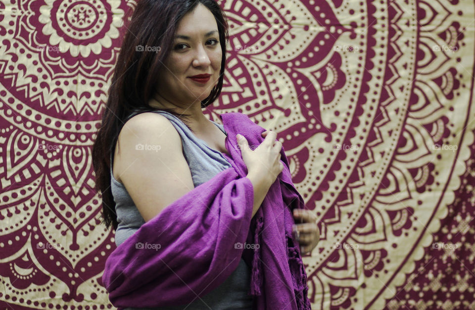 woman wearing purole traditional Mexican rebozo scarf