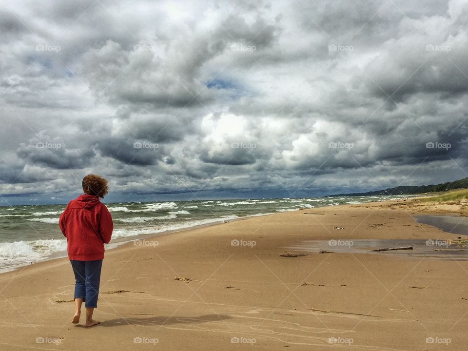 Rear view of standing on the beach