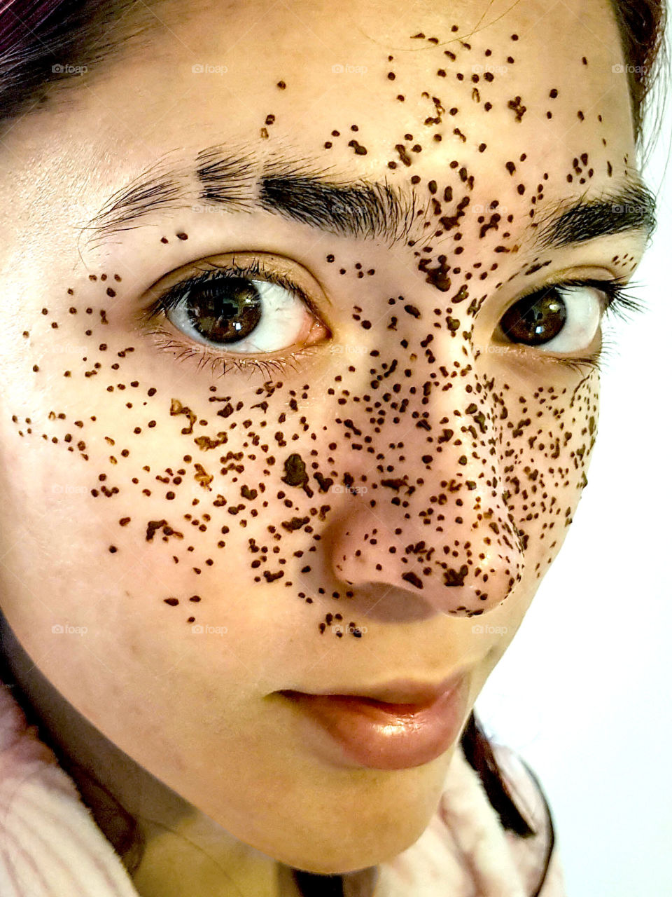 Pretty teen girl with heena freckles