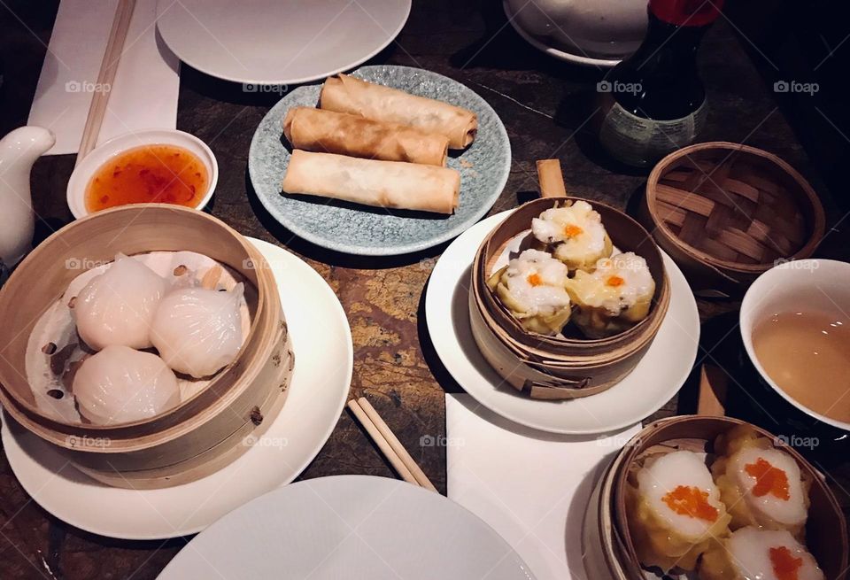 Chinese assorted dim sum dinner including spring rolls, buns and dumplings, steamer basket, Asian cuisine, Cantonese cuisine, Chinese cuisine 