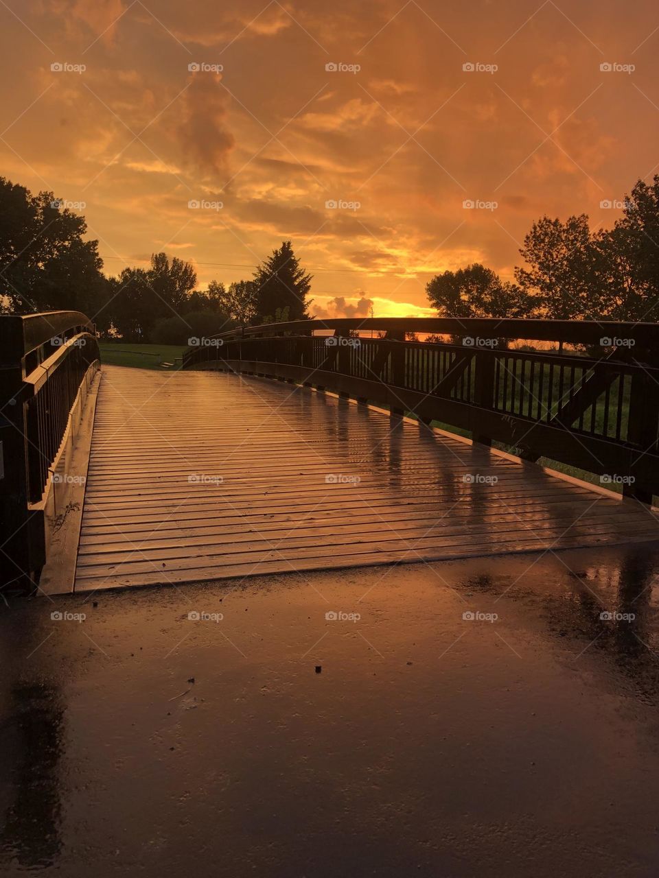 A bridge at sunrise after a warm summer rain fall