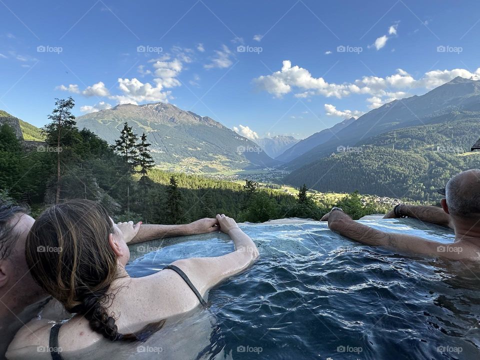 People enjoying the view from the pool