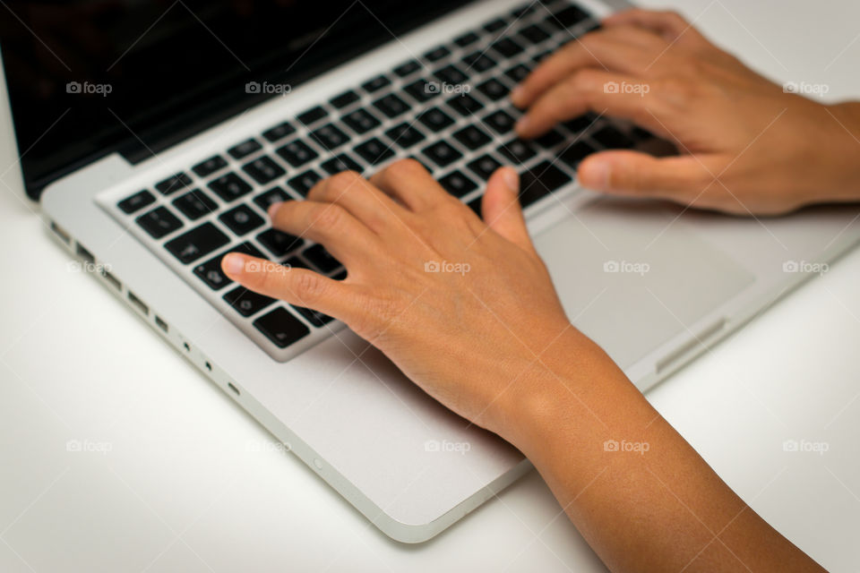 Woman while she is working at the computer