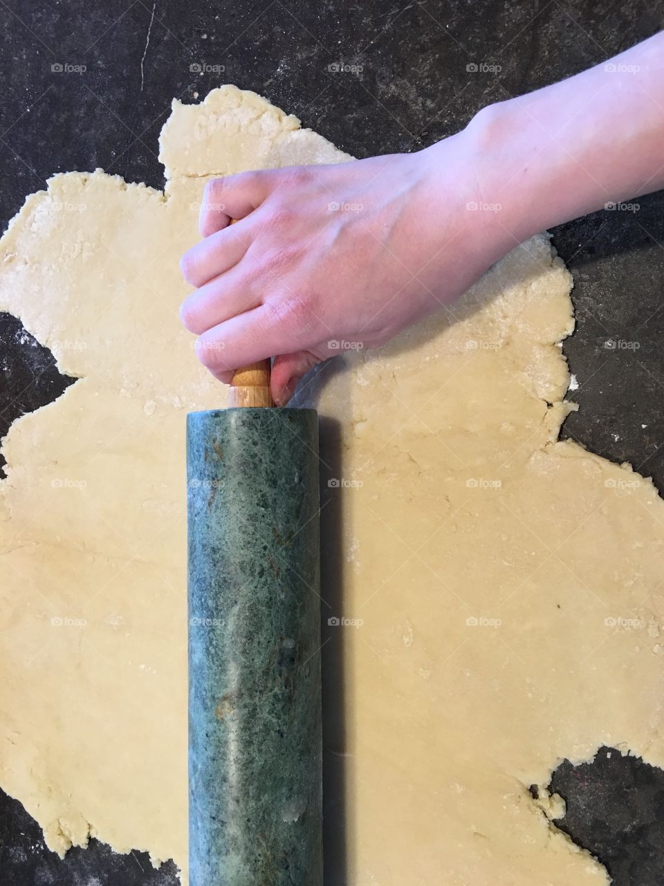 Rolling out the sugar cookie dough.