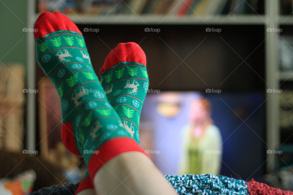 Watching tv at home, Christmas pattern socks