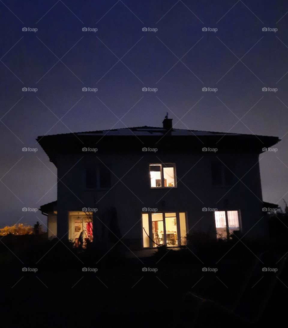 illuminated house in the evening