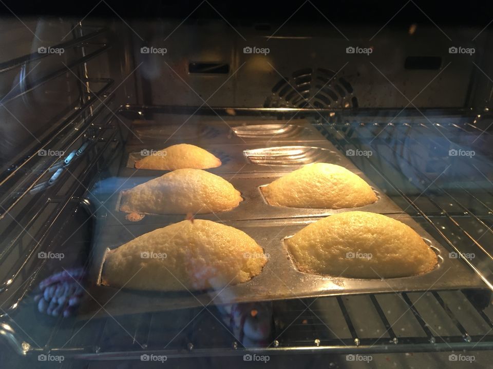 Madeleines cooking in oven