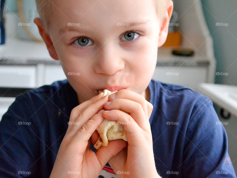 Boy eating taco