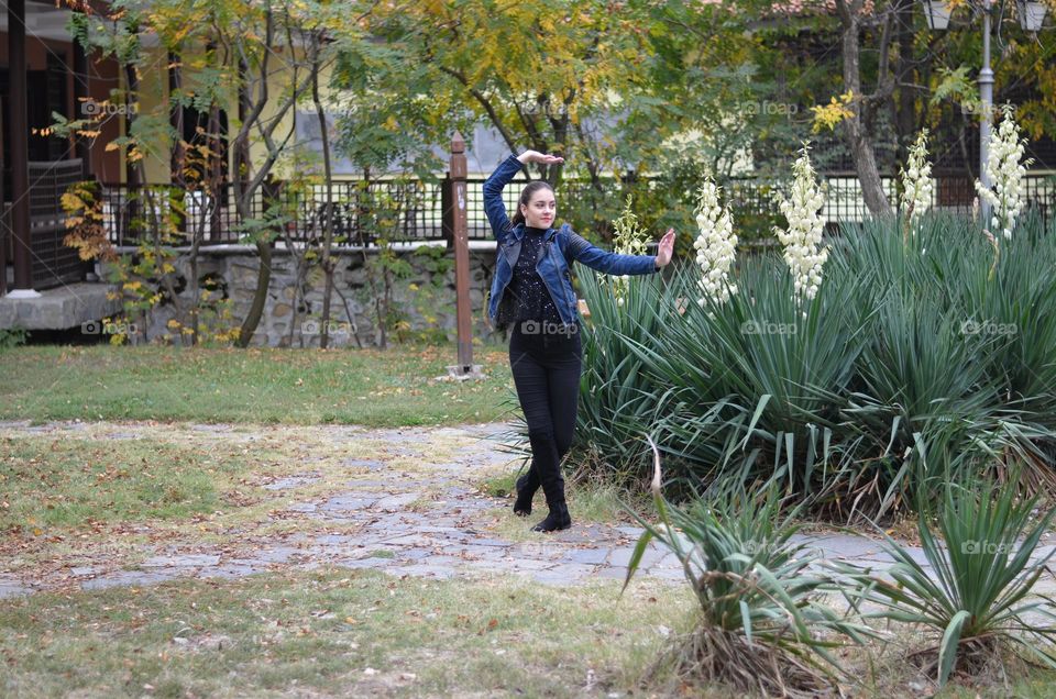 Beautiful Young Girl Dancing Outside in Nature