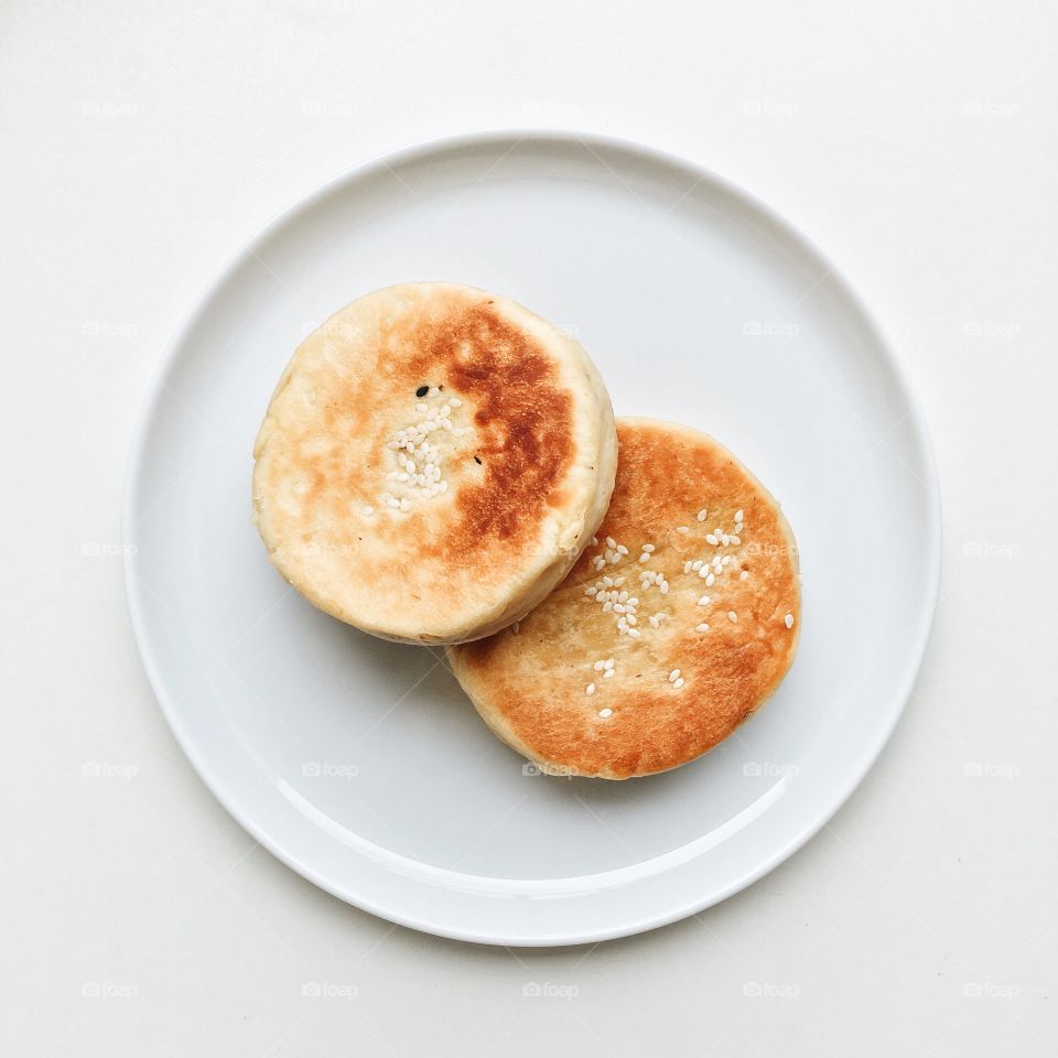 Sweet potato pancakes on a white plate.