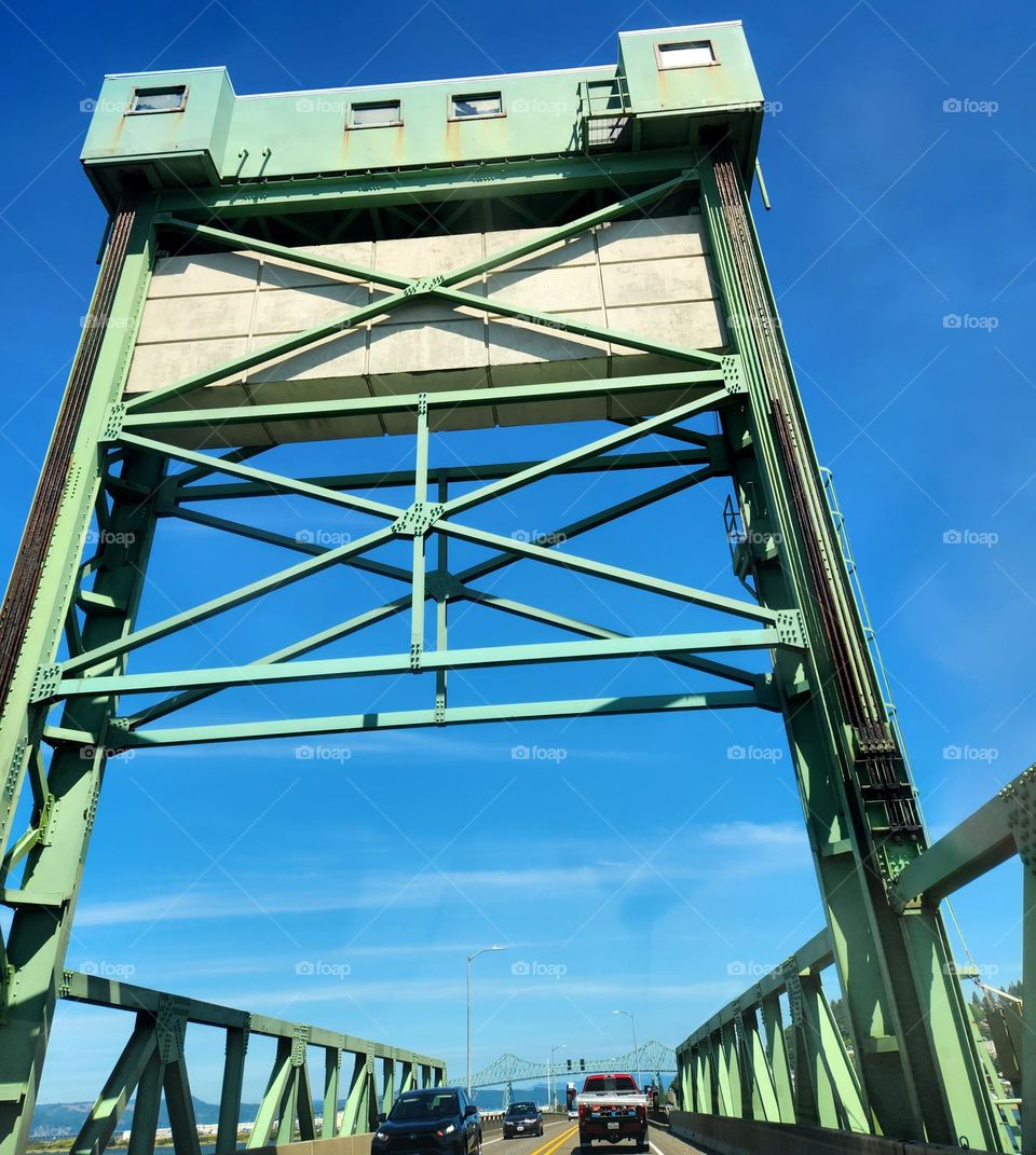 Oregon bridges such as this green coastal structure are impressive architectural marvels to drive under and across