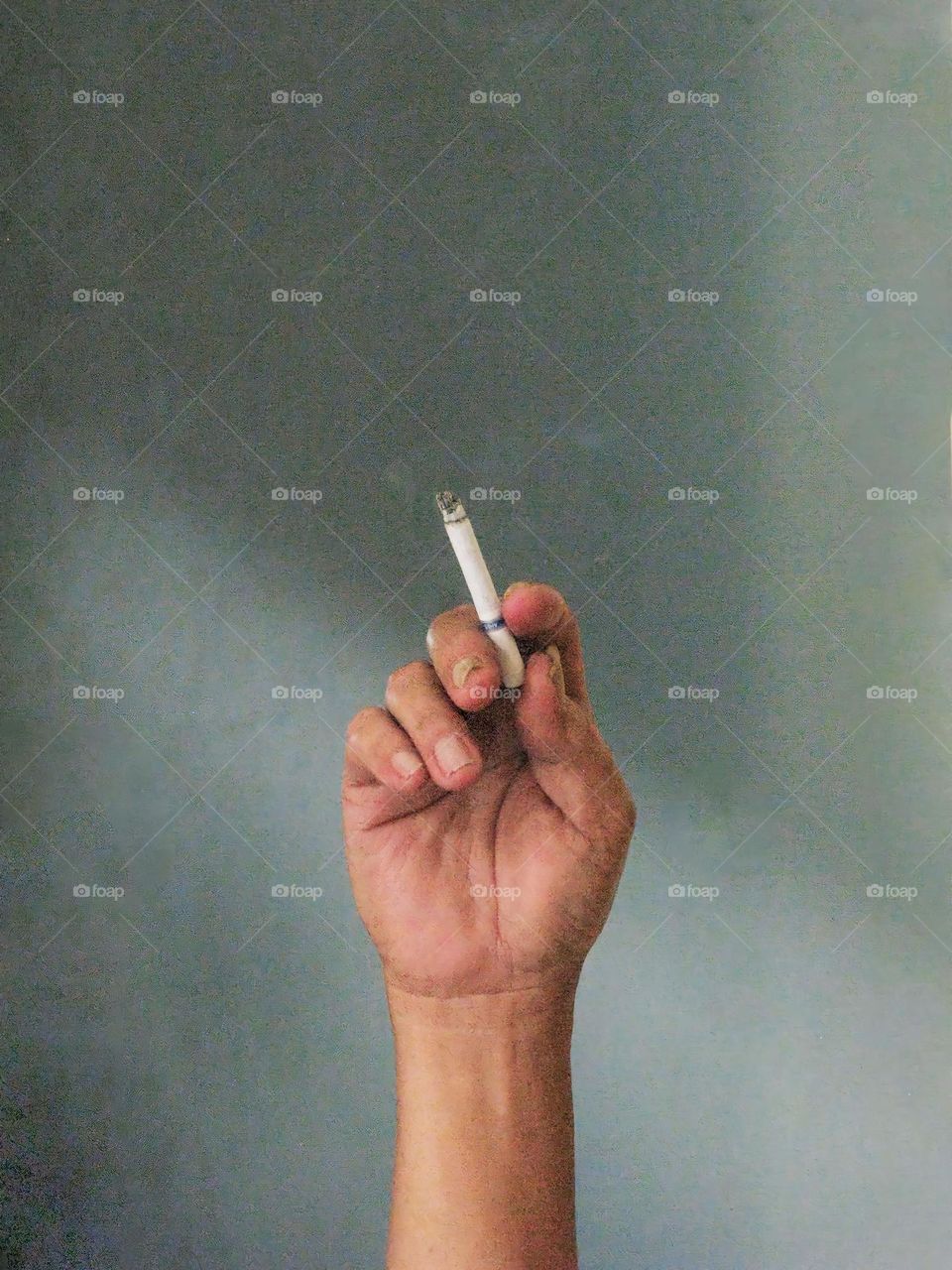 Close-up of man smoking a cigarette