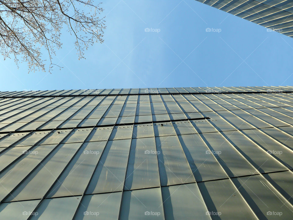 Low angle view of modern built structure of the Jewish Museum Berlin against sky.
