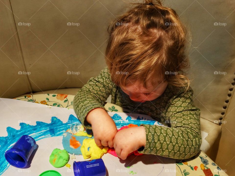 Toddler Playing With Clay. Young Girl Making Art
