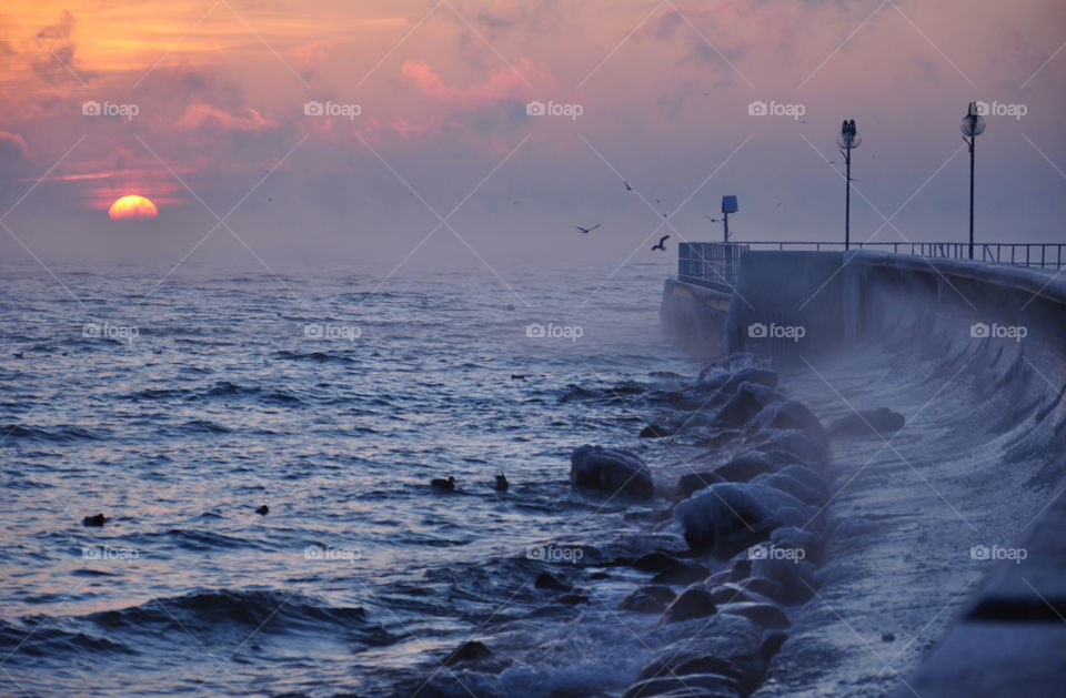 foggy sunrise over the baltic sea in poland