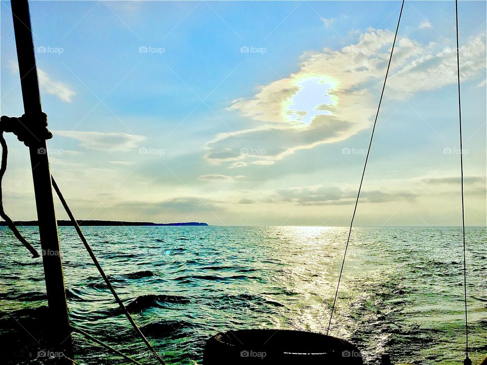 On a beautiful summertime afternoon we took the “Salvation” on a journey on the waters of the East River and into the Atlantic Ocean and took this photograph of an especially golden sunset. 2019. Hypnotic Productions