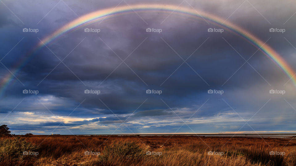 beautiful rainbow on Sky... on horizon colors... you always find meet .. save the Earth for beautiful life ...