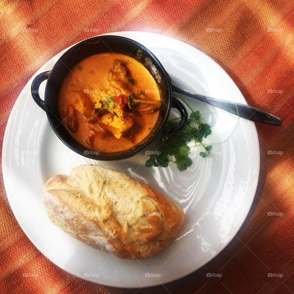 A deliciously warm and vibrant dish of chicken and prawn curry. Soul food to nourish the heart.