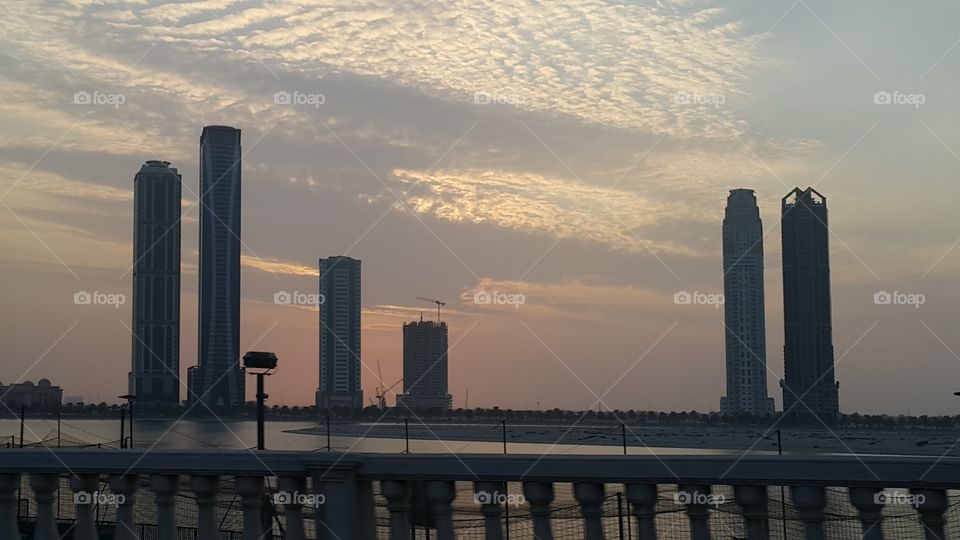 sunset, skyscraper, water