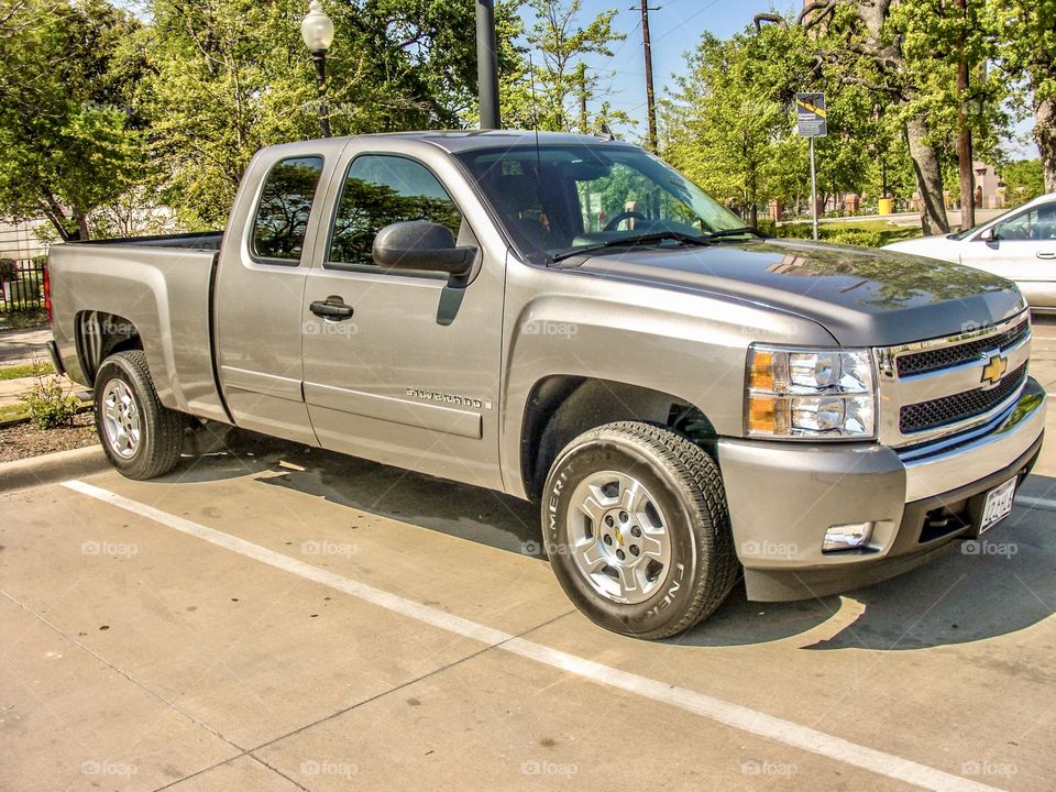 2007 Chevrolet Chevy Silverado Extended Cab in silver metallic birch color with standard bed and LT package.