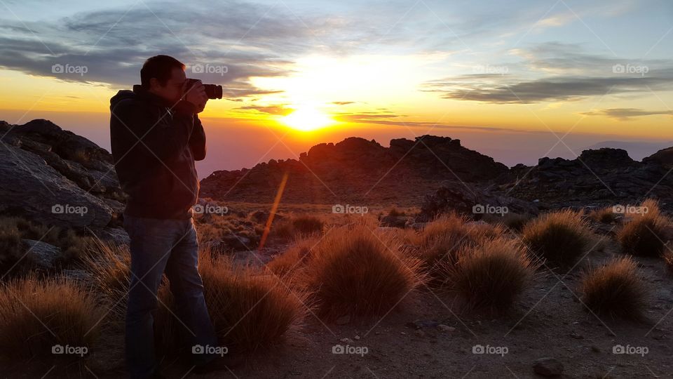 photographing landscape at sunset