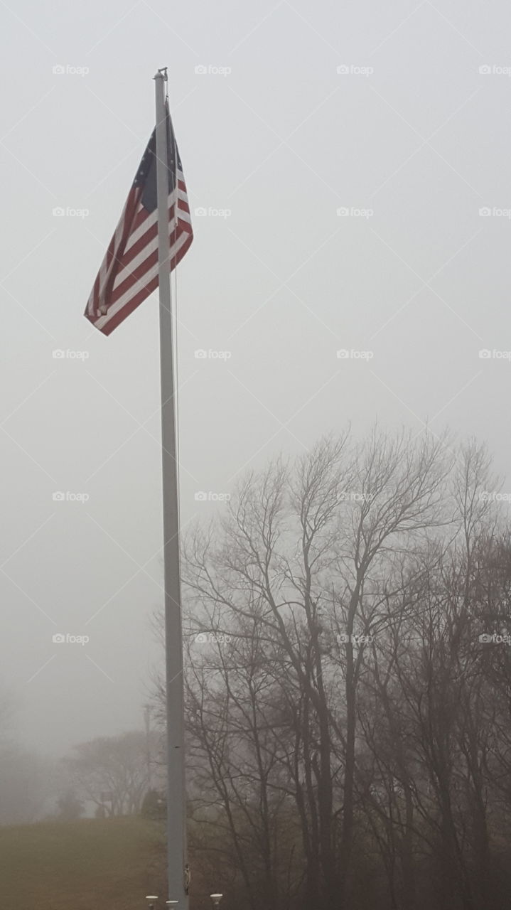 american flag in the fog