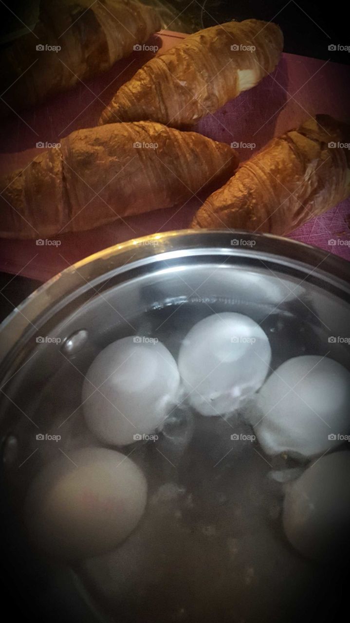 Delicious croissants from the oven, with white boiled eggs. Delicious for breakfast or a nice lunch.