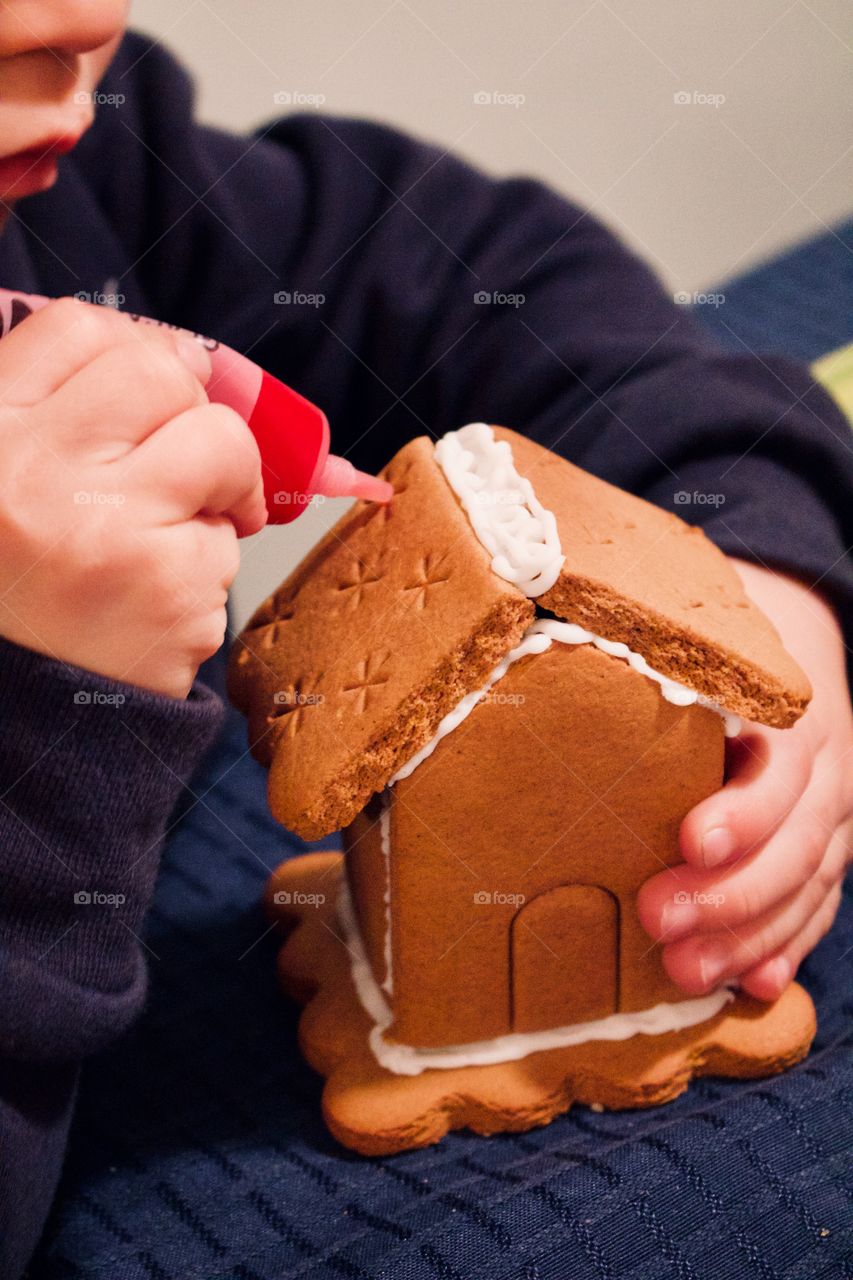 Decorating gingerbread houses for Santa 