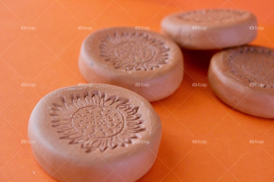 Orange Color Story - terra cotta discs with sunflower imprint