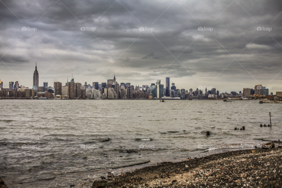 beach city clouds water by stockelements
