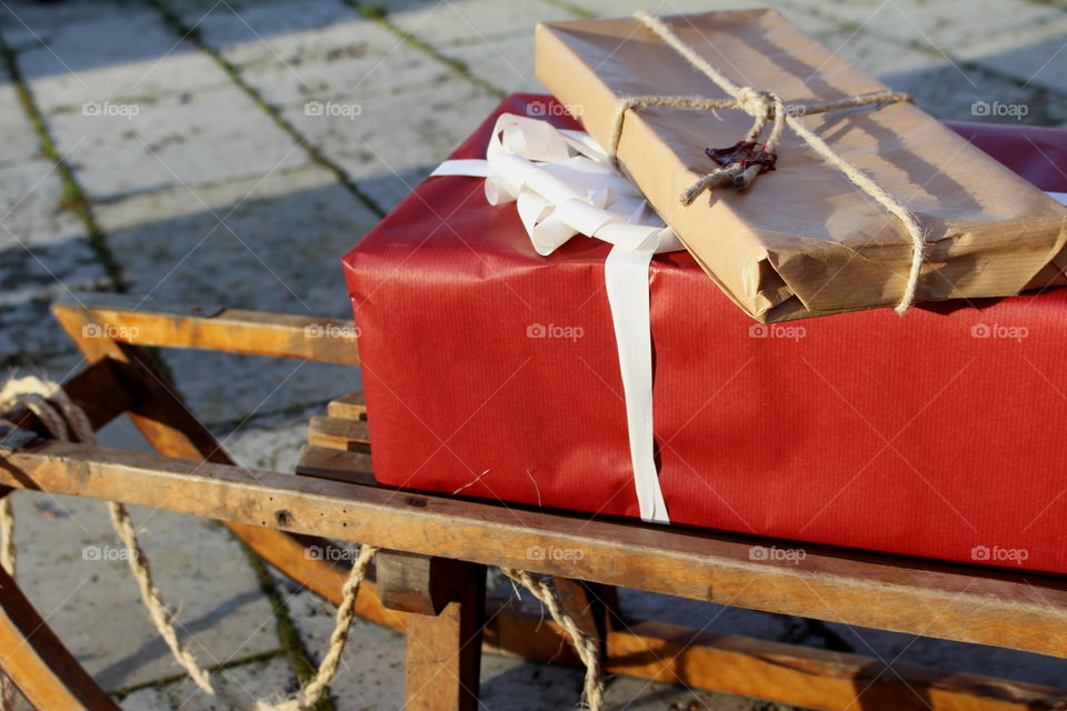 Christmas gifts on a sleigh.