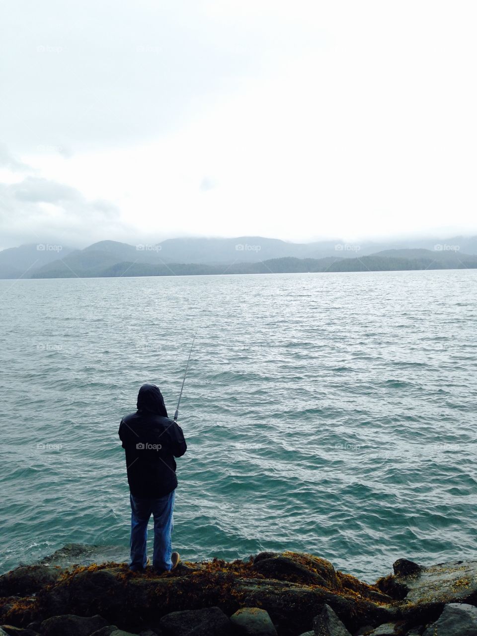 Fishing off the rocks on north Tongass highway in Ketchikan Alaska 