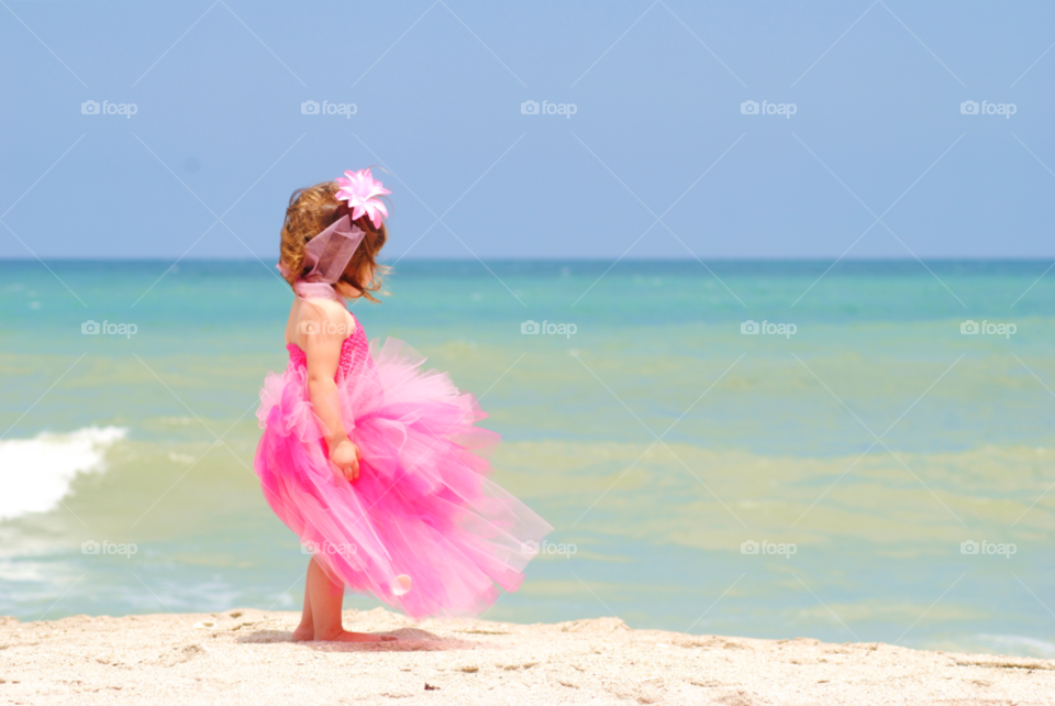 Girl standing at beach