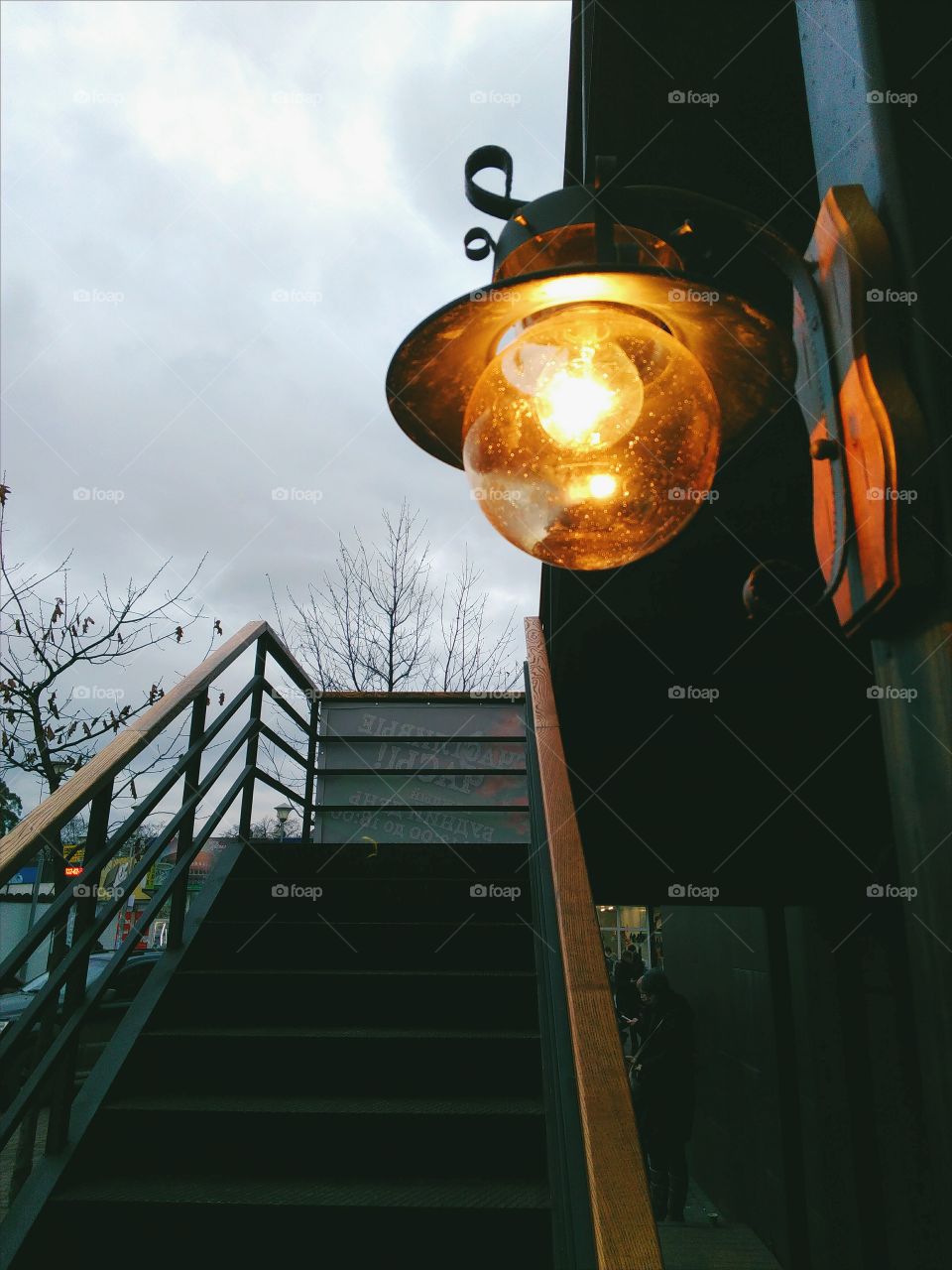 glowing lantern at the entrance to the stairs