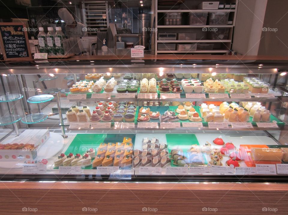 Glass Display of Colorful Desserts