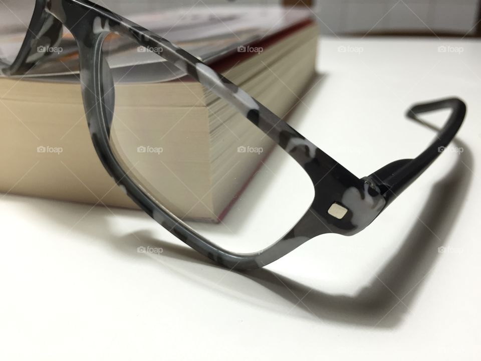 Eyeglasses on a book 