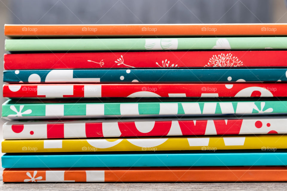 a stack of colorful magazines