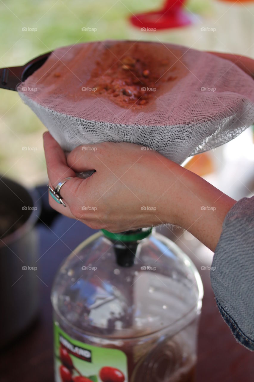 straining apple cider